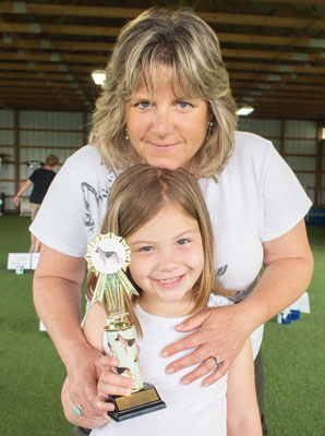 Ali Brown and daughter, Cyan, after Cyan wins her C-WAGS Rally level one title.